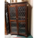 Large 2-Door mid-20thC Mahogany Bookcase, with diamond glazed patterned doors, opening to 4