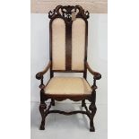 Early 20th C Carolean style walnut Armchair, tall back, cream padded seat and double panel padded