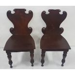 Matching pair of mid 19thC mahogany Shield Back Hall Chairs with turned rundels on turned front legs