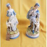 Pair of late 19th C continental porcelain figures of a lady with a dog & a gentleman decorated in