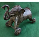 Interesting antique bronze Elephant, mounted on 4 wheels (possibly an early children’s toy) 22cm w