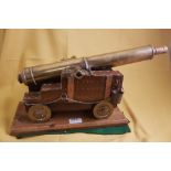 Hand crafted Brass Cannon with 41cm barrel and drilled vent, raised on a stepped wooden carriage