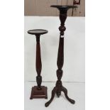 Edwardian mahogany Torchere Stand, the circular top over a reeded and leaf carved stem on a