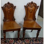 Matching Pair of late 19thC Mahogany Hall Chairs with acanthus mouldings over shield shaped