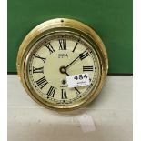 “Royal Navy” 8-day brass framed Ship’s Clock (made in England), with bevelled glass front pane, 20cm