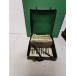 A Hohner Alpina accordion, cased, button keyboard