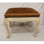 Carved pine stool, painted cream with gold padded seat 60cm wide