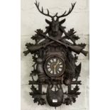 Large South American Cuckoo Clock, highly carved with game bird side reliefs of a rabbit and a