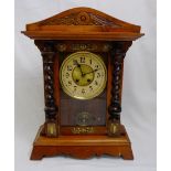 American Mantel Clock, with brass mounts and roped columns to front door, with a repeat alarm,