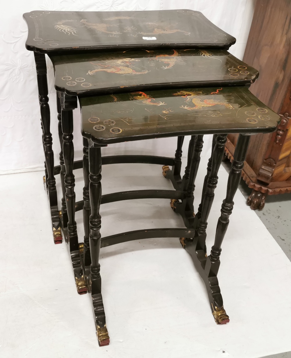 Nest of 3 mid 20th C Chinese lacquered Tables, each featuring painted dragon designs on green bases,