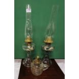 2 moulded glass oil lamps with globes and a small hand lamp (3)