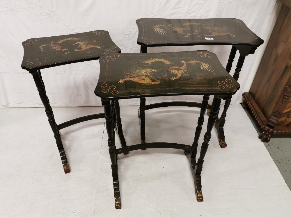 Nest of 3 mid 20th C Chinese lacquered Tables, each featuring painted dragon designs on green bases, - Image 2 of 2