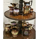 13 Pieces of Brown Lustre Ware including Jugs of various sizes and 1 teapot, colourful patterns