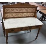Edw. Oak 2-drawer Washstand on turned feet with a white marble top & brown floral tiled splash back,
