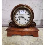 Mantel Clock, in a circular case with scrolled sides, chiming, with a brass border to the painted