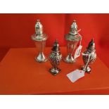 A Pair of English Silver Pepper Pots, ovid-shape with waved detail (stamped), 9cm high & a Pair of