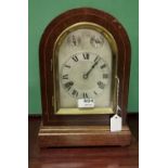 Bracket Clock in a domed mahogany case (spring not working) with a silvered dial, Westminster