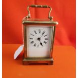 Brass cased Carriage Clock, the works stamped FRANCE, (no glass to back), 12cm x 9cm