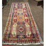 A colourful Persian style long carpet/runner, 3.1m x 1.1m, multiple pattern throughout
