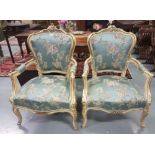 Matching Pair of Carved Framed Armchairs, highlighted with gold detail, decorative mouldings and