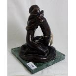 A bronze of seated entwined young lovers on a green marble plinth by RHYS PRYCE stamped, possible