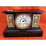 Ansonia Mantle Clock, in a black metal case, with brass scrolled side panels