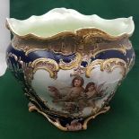 Large pottery Jardinière, bulbous shape, with frilled rim, blue ground with decorative cherub