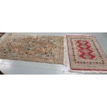 A beige ground Persian style carpet 122cm x 205cm & a smaller pink wool carpet, 152cm x 94cm, a long