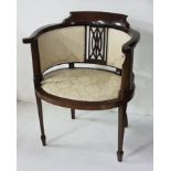 An Edwardian inlaid mahogany & upholstered elbow chair, bow shaped, cream floral fabric