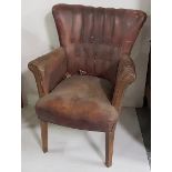 Highback Armchair, with brass studs to back and sides, worn red leather upholstery, tapered legs