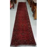 Antique Heriz Carpet, red ground, with multiple central medallions, 4.85cmL x 80cmW