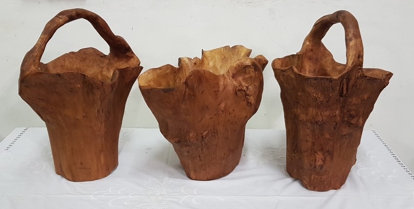 A Pair of carved Indonesian Root Buckets with Handles and a similar open bucket, each 48 cm h (3)