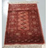 Two floor rugs – Bacarra Pattern, 1 pink ground & 1 red ground