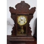 Gingerbread Mantle Clock, the painted dial stamped "Welch", in a carved case, 60cm x 40cm