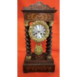 Rosewood framed and marquetry inlaid Mantle Clock, with turned columns and a visible pendulum,