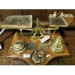 A large set of brass scales and weights, good quality with 2 completed sets of round brass