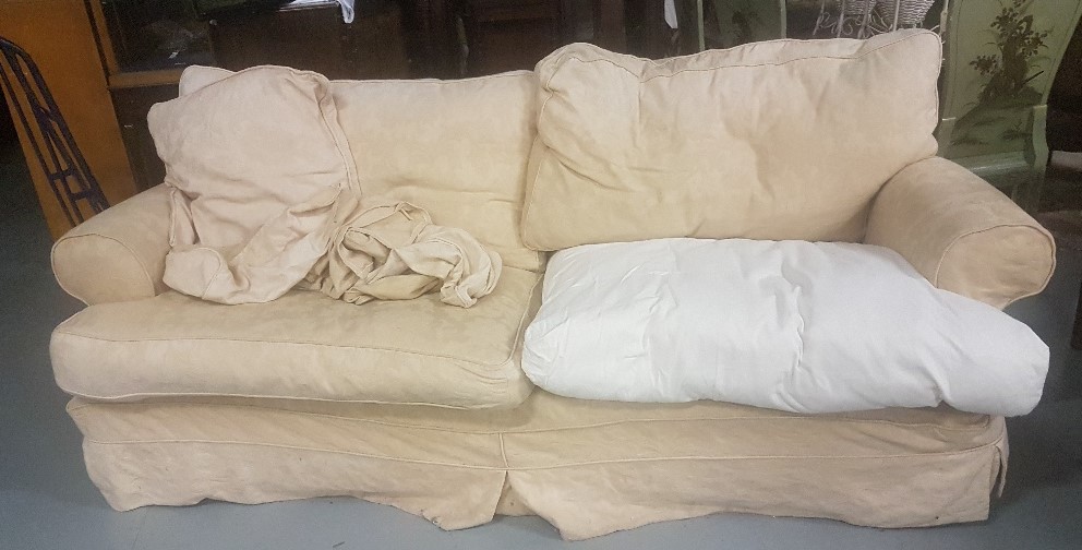 Large 4-seater Sofa with loose covers to the feather cushion seats