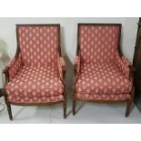 A matching pair of modern French style beech framed armchairs, covered with classical mauve and