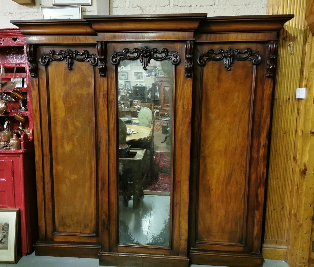 Lg. Victorian Mahogany Wardrobe with a central mirrored door, silvered edging and two side closets