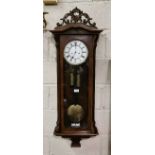 Vienna Wall Clock, with double weights and a white dial with a carved finial above, 1.15cm h