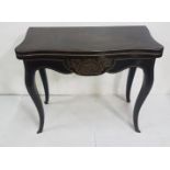 Regency Ebonised Card Table, serpentine shaped, on sabre legs, brass inlaid throughout, folds over