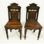 Matching Pair of Edwardian Mahogany Hall Chairs, with a pierced back above turned front legs