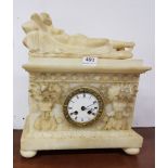Alabaster Mantel Clock, featuring a reclining lady over the ornately decorated case, also floral