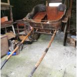 Pony Trap, with two rubber shod wheels, labelled “Coonan, Nenagh” (no cushions)