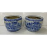 Pair of circular Blue and White porcelain Jardinières, decorated in relief with Chinese landscapes