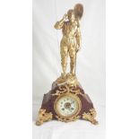 French Mantel Clock, mounted with a spelter figure of an Oarsman, gold painted and on a red marble