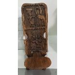African carved hardwood Shield Chair, with giraffe and trivial carvings, 40cm h