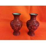 Matching pair of bulbous shaped late 19thC Chinese Red lacquered vases, green cloisonné inside,