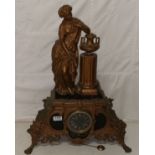 French gilt mantle clock mounted with a spelter figure of a lady wearing a cloak, black dial, marble
