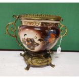 Early 20th C ceramic Flowerpot in an ornate brass frame with carrying handles, the exterior